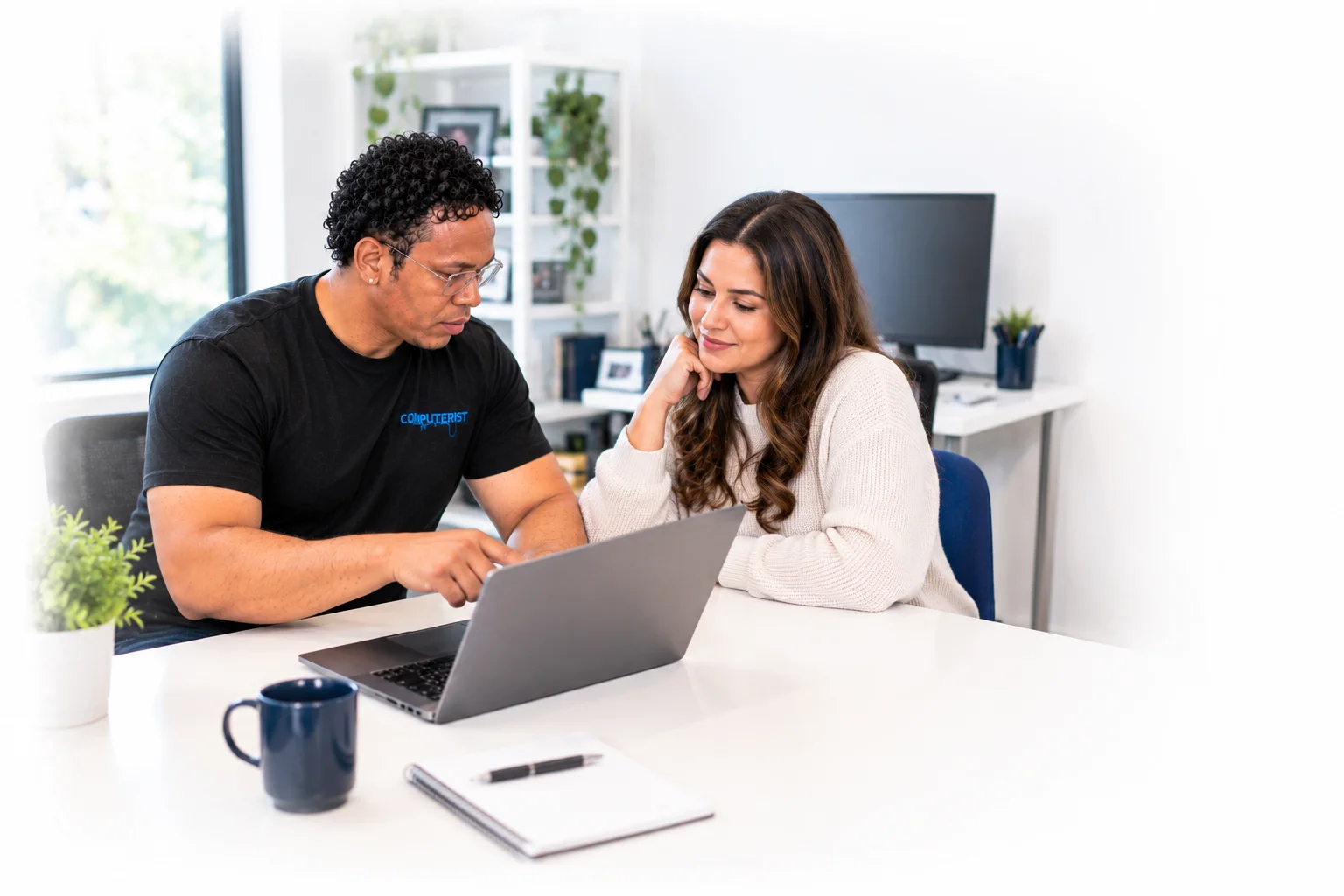 Computerist technician helping with software installation and support